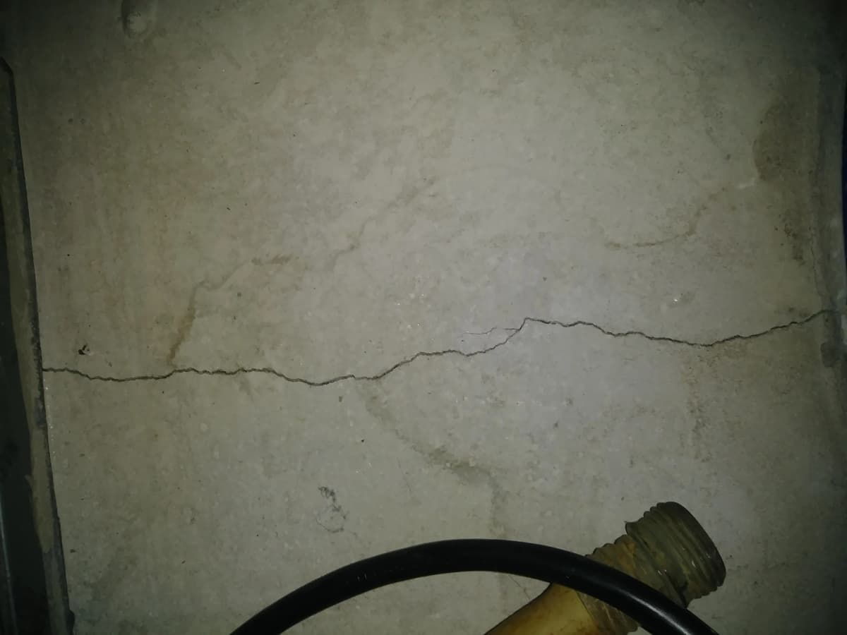 Foundation wall crack requiring professional repair and injection sealing