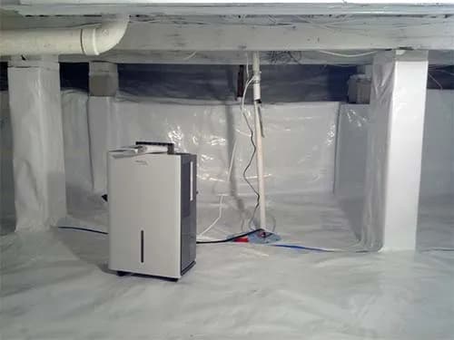 Basement after professional sump pump installation showing dry, protected space